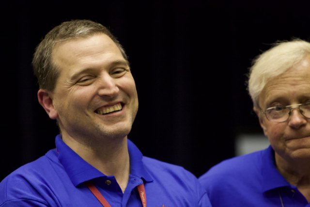 Two Happy Men in Blue Shirts