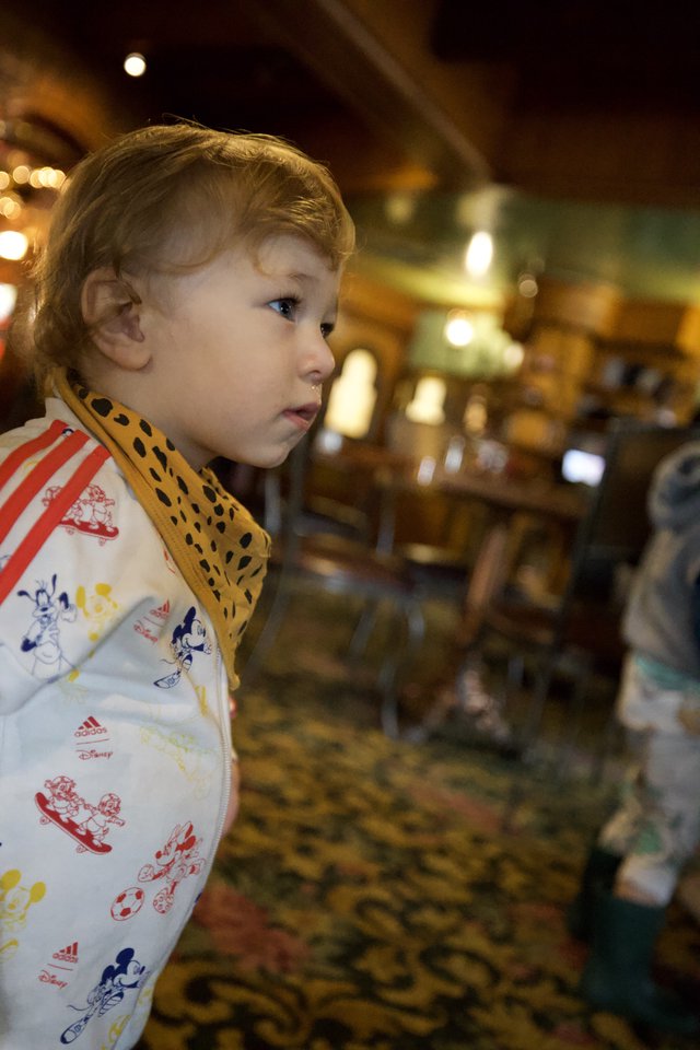 Young Child Admires Ornate Carousel at Madonna Inn