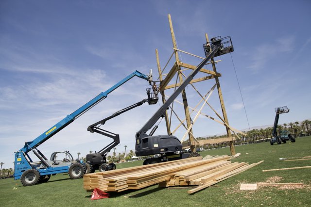 Wooden Construction Crane Lifts Lumber
