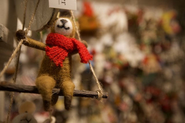 Felted Sloth Ornament with Red Scarf on Swing