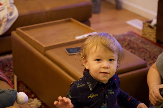 Toddler in Train Pajamas at Christmas Gathering