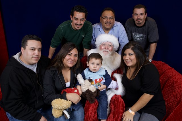 Smiling Family with Santa Claus