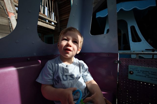 Toddler Enjoying a Sunny Day at Fantasyland Playground