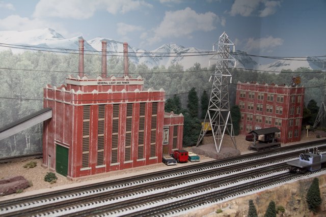 Red Building and Steam Train on Display