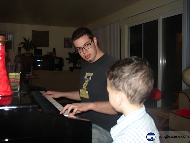 A Joyful Duet: Father and Son Play the Piano Together