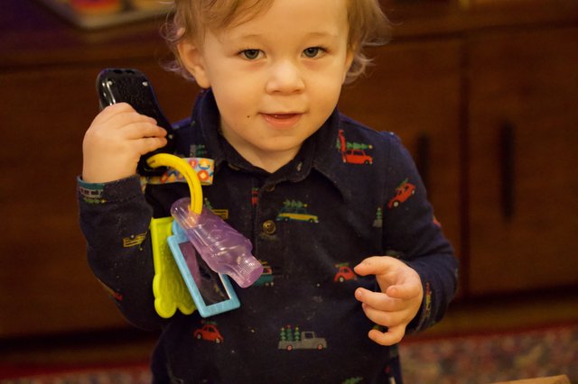 Toddler with Toy Keys on Christmas Morning
