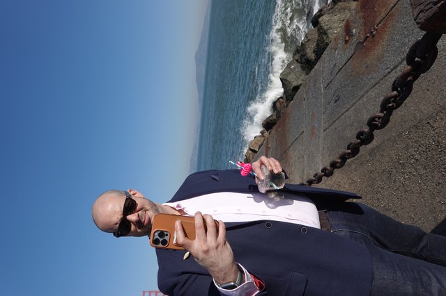 Business Professional Taking Seaside Selfie with Drink