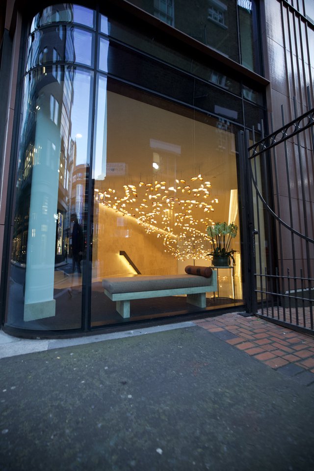 Modern Hotel Lobby Entrance with Illuminated Tree Sculpture