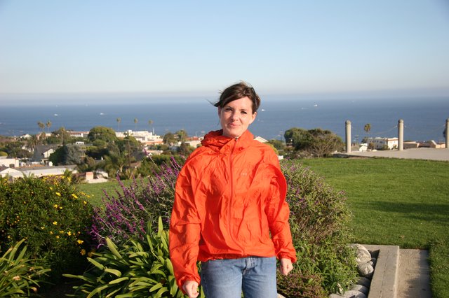 Woman in Orange Jacket by Pacific Coastal Overlook