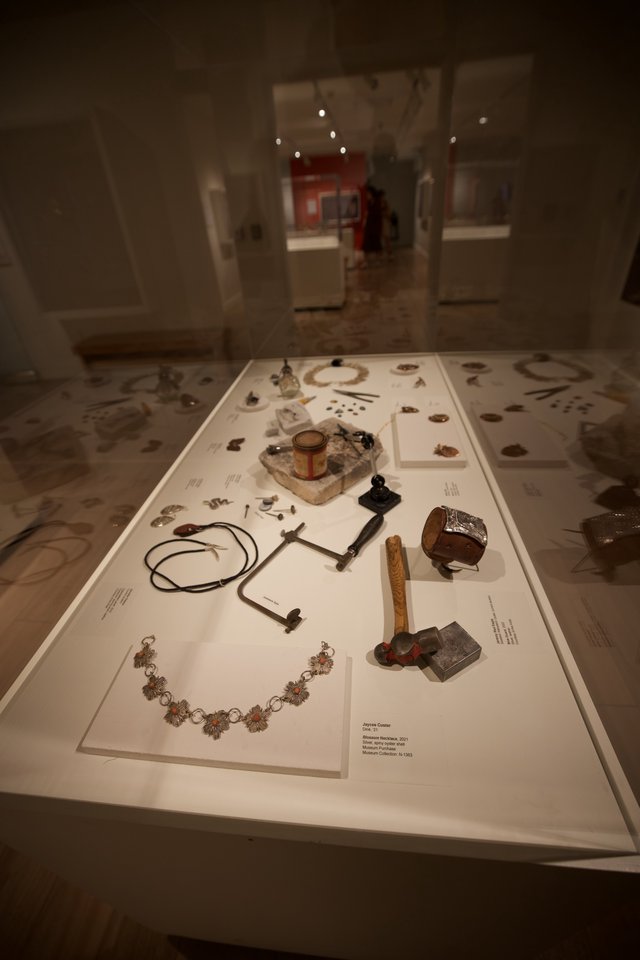 Museum Display Case with Historical Artifacts and Jewelry