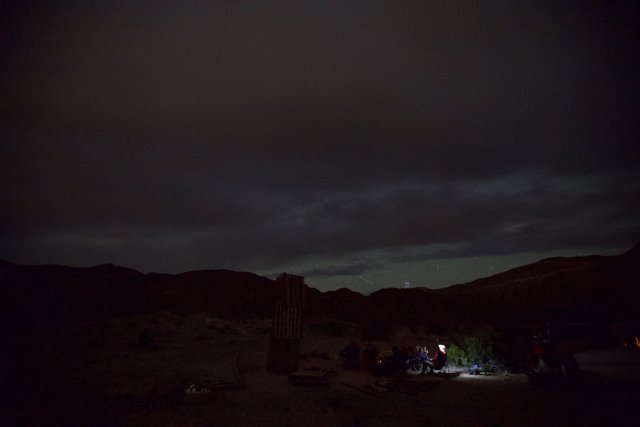 Campfire under the Starry Desert Sky