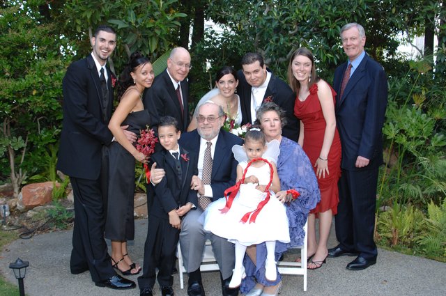 Joyful Wedding Family Portrait in Garden Setting