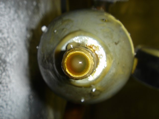 Yellow Water Flowing Through a Pipe