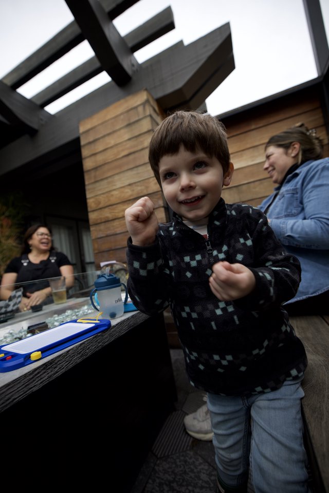Joyful Child at Outdoor Patio Gathering