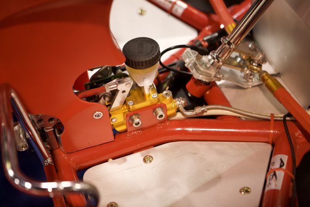 The Engine of a Red and White Motorcycle