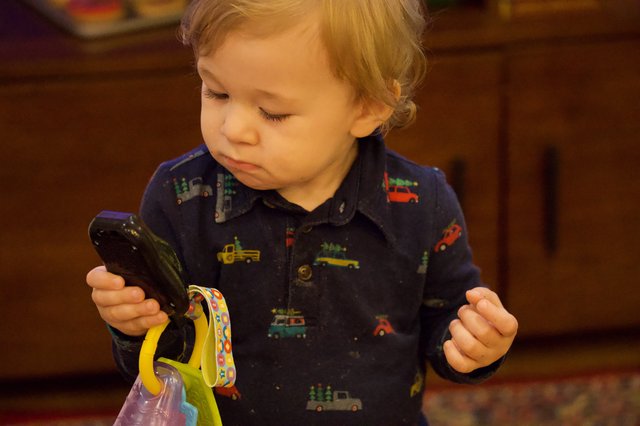Toddler Exploring Smartphone During Christmas Time