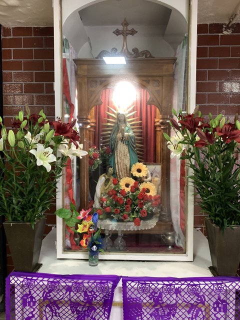 Shrine of the Virgin Mary adorned with Flowers