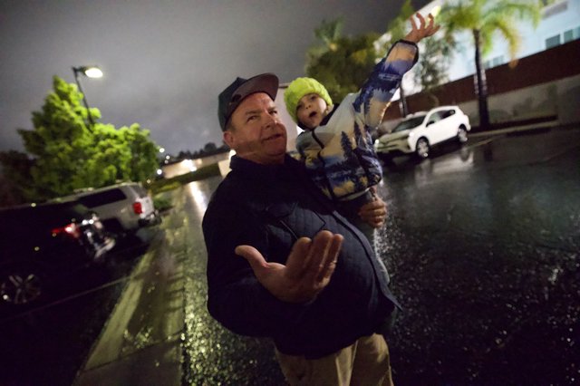 Father and Child Rescued During Nighttime Flood Emergency