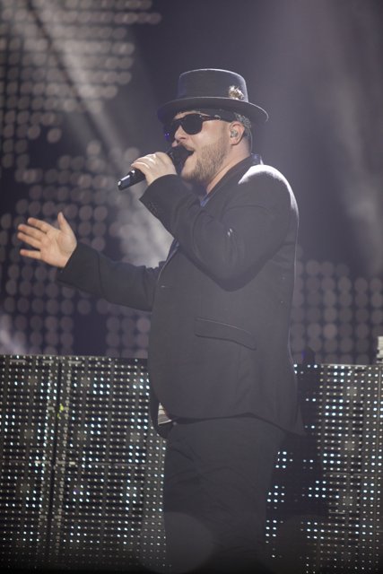 Solo Performance in Fedora Hat and Suit