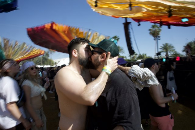 Embrace in Motion: A Romantic Interlude at Coachella 2024