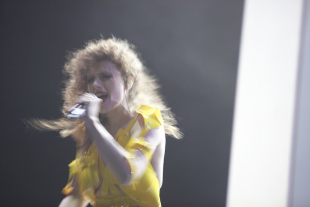 Yellow-Dressed Woman Shines on Coachella Stage