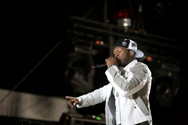 50 Cent Rocks the Stage in a White Jacket and Hat