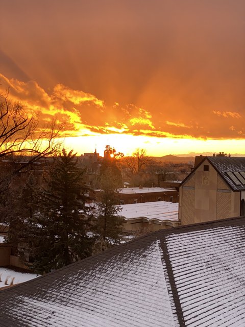 Fiery Sunset Behind Snowy Shelter