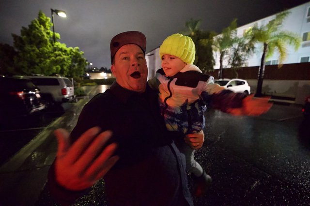 Father and Child Caught in Moment of Surprise