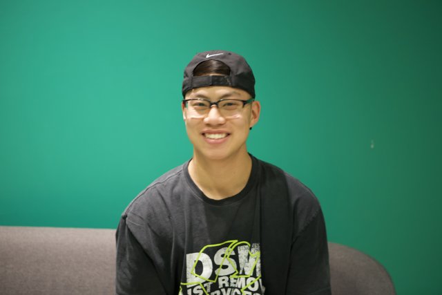 Smiling Teen in his Black Hat and Shirt