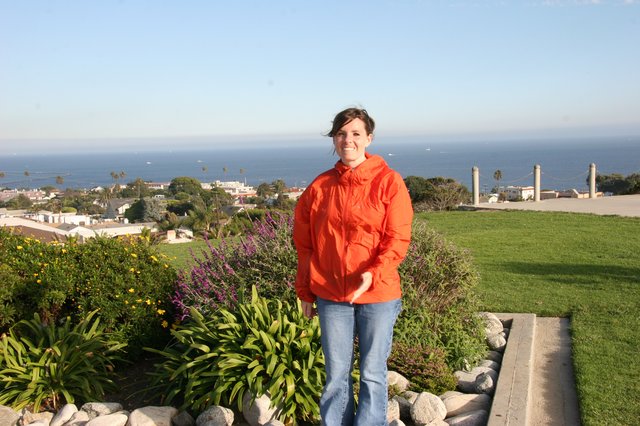 Woman in Orange Jacket at Coastal California Overlook