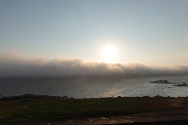 A beautiful sunrise over the foggy California coast