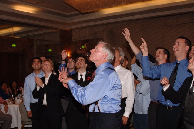 Groomsmen Erupt in Joy at Wedding Reception