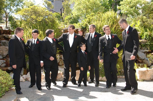 Groomsmen Gather in Garden Before Wedding Ceremony