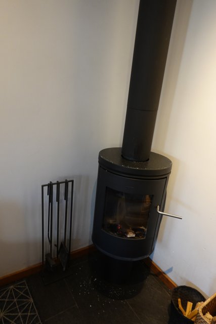 Cozy Combination: Wood Burning Stove and Fireplace
