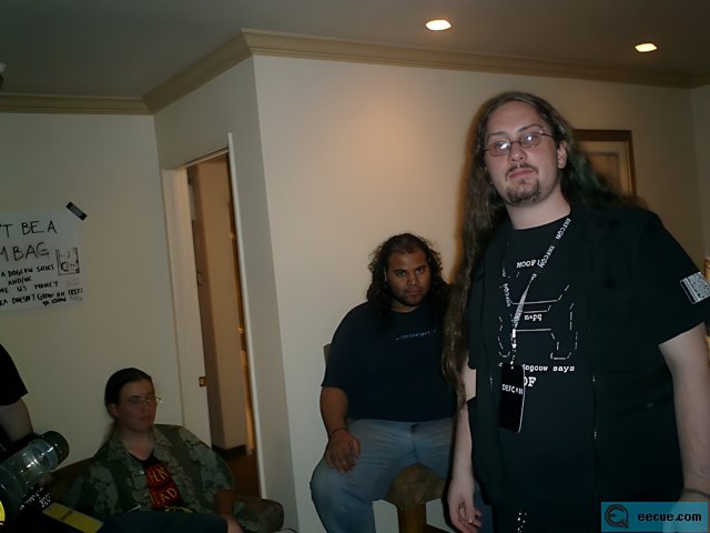 Long-Haired Man in a Room Full of People