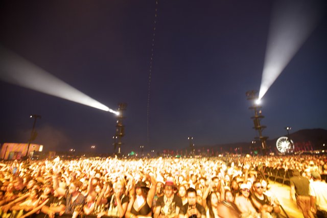 Illuminated Concert Crowd Under the Night Sky