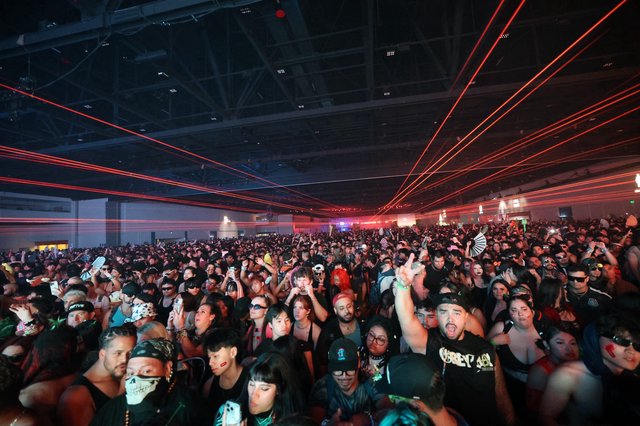 Red Laser Light Show Over Massive Rave Crowd