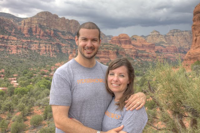 Couple Smiling Against Sedona Red Rock Backdrop