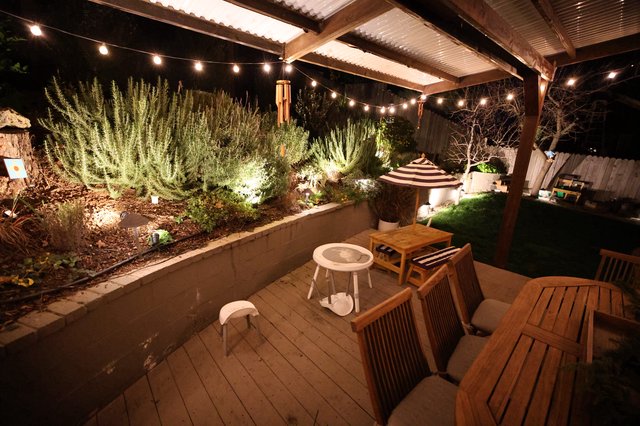 Cozy Backyard Patio with String Lights at Night