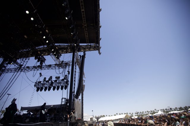 Concertgoers soak in the sun while watching their favorite performers