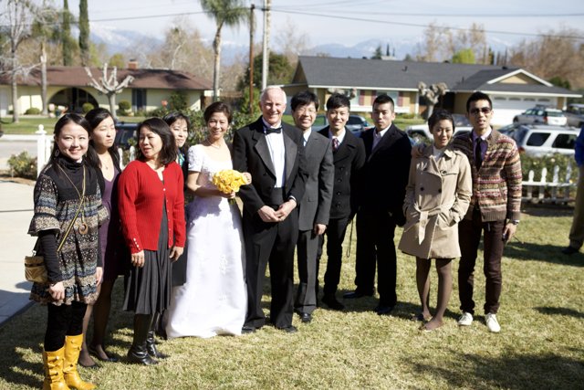 Wedding Party in Front of Grand Home