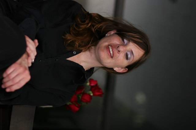 Penelope Smiling Among Red Roses Valentine's Day