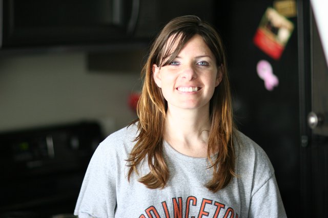 Smiling Woman in Princeton Sweatshirt at Home