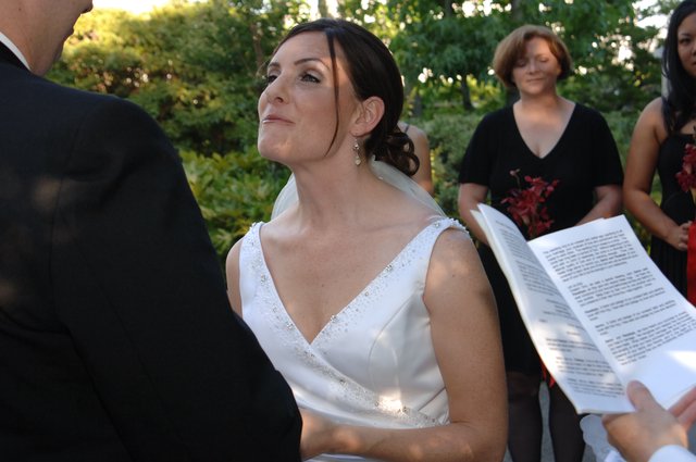 Bride's Emotional Gaze During Outdoor Wedding Ceremony