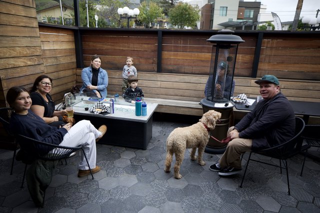 Family Gathering on Dog-Friendly Restaurant Patio