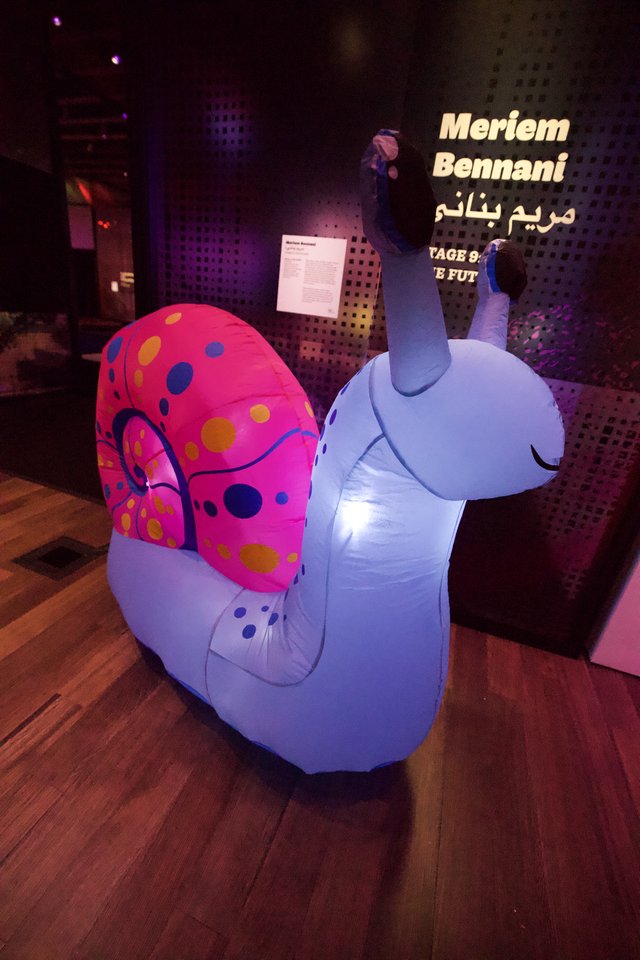 Colorful Inflatable Snail Art Installation at Museum