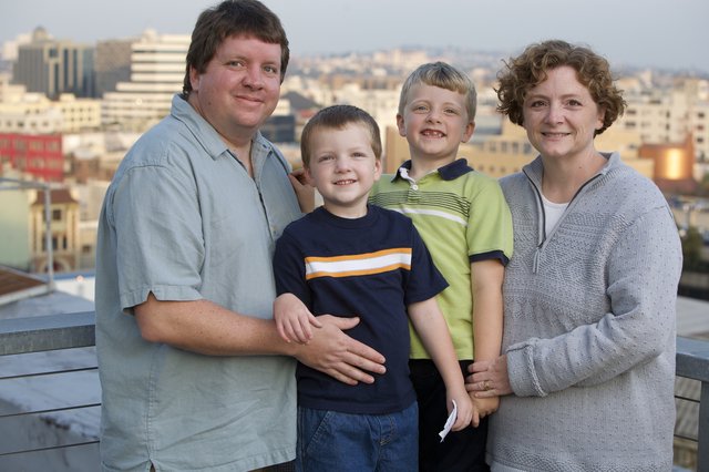 Family Portrait on Urban Rooftop at Dusk