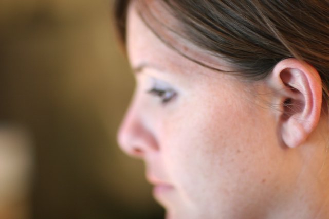 Pensive Profile of a Freckled Woman in Shallow Focus