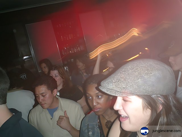 Nightclub Party with Hat-Wearing Man
