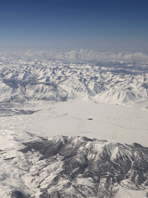 Majestic Snow-Capped Mountains from Above